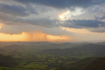 distant rain storm over a valley in Lalibella, Ethiopia