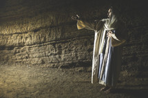 Jesus standing in a cave 