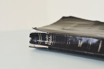 A well used Bible with broken binding.