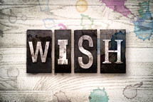 word wish on a white wash wood background 