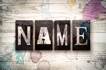 word name on a white wash wood background 