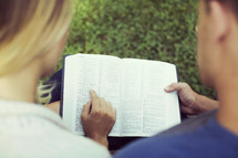 a couple reading a Bible 