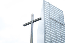 cross and tall building 