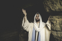 Jesus standing at the entrance of a tomb 