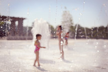 children at a splash pad 