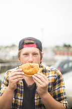 a man eating a sandwich 