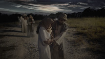 Pregnant Mary and Joseph traveling to Bethlehem.