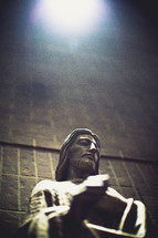 sunlight on a statue of Jesus