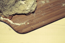 A chunk of bread resting on a cutting board