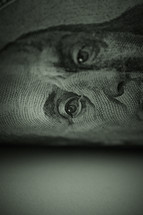 A close up look at a one hundred dollar bill
