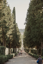 people walking on the paths in a garden in Italy