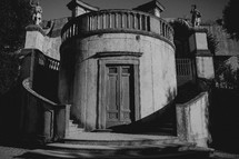 circular staircase in front of a house in Italy 