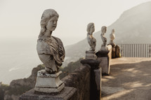 busts along a railing in Italy 