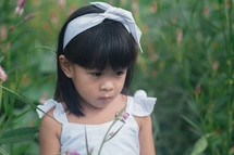 portrait of a little girl in a field 
