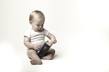 A toddler looks curiously at the Bible