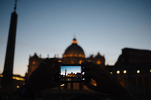 taking a picture of St Peters Basilica in Rome at night 