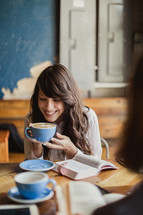 women reading Bibles and drinking coffee at a Bible study 