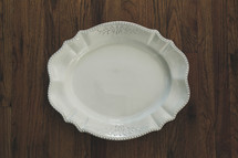 white serving plate on a wood table 