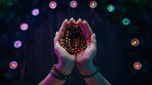 Woman reading mantras or prayers, counts malas strands of wooden beads used during meditations. Lady sits among candles and peacock feathers. Spirituality, religion, God concept.