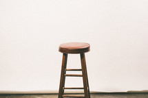 stool in an empty room 