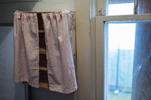 tiny pink curtains on tiny vintage shelving