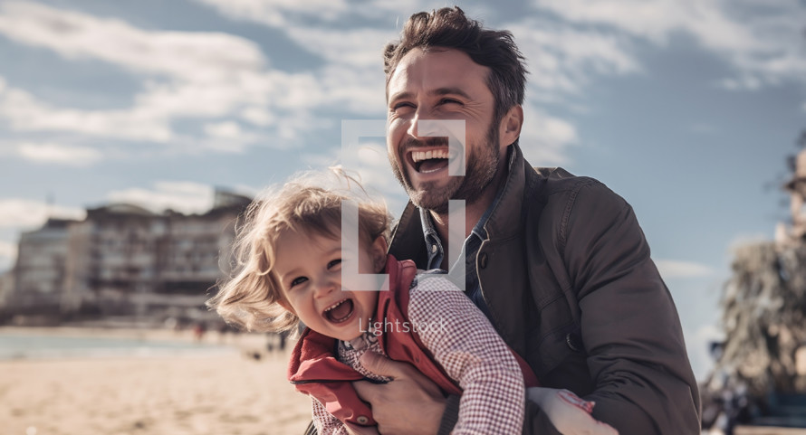 Father and child on the beach smiling 