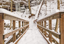 snow on a wooden footbridge 