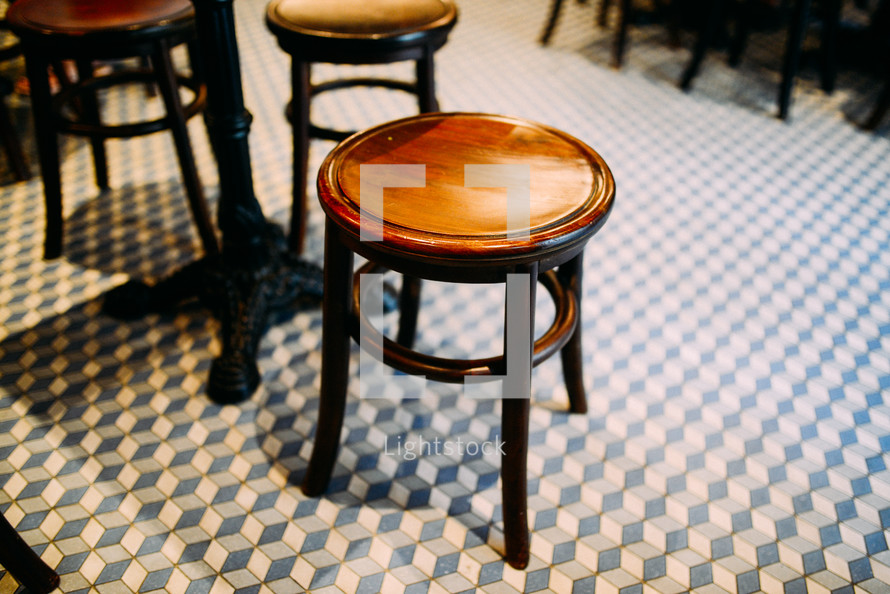bar stools on a tile floor 