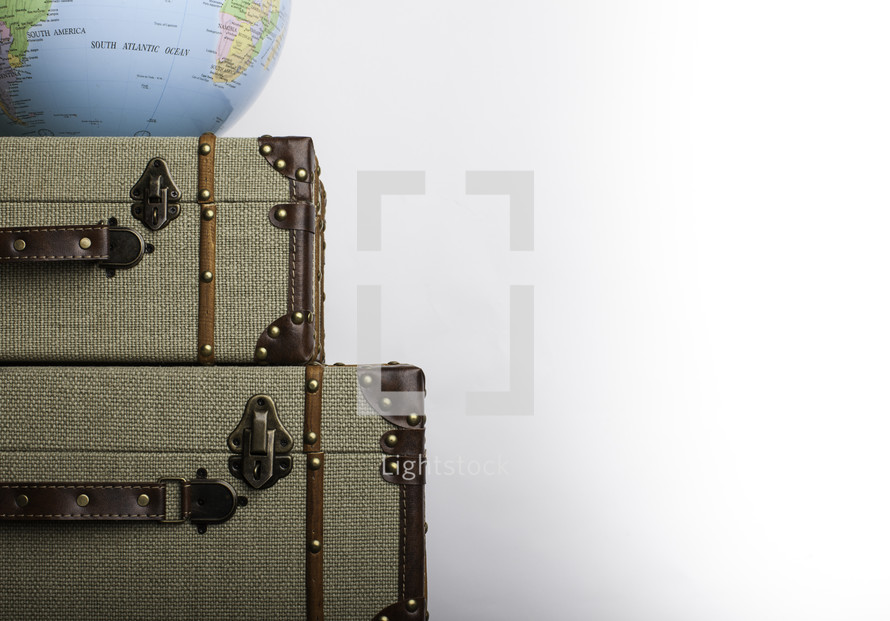 globe on suitcases 