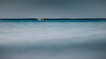 man swimming in the ocean 
