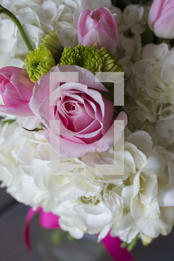 pink and white flowers in a bouquet 
