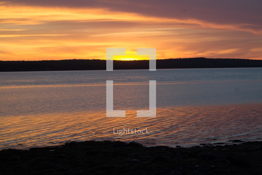 Maine shoreline at sunset 