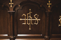 Woodworking on an altar with gold lettering