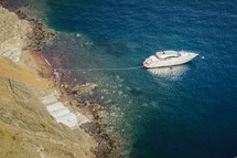 boat tied to a shore in Santorini, Greece 