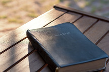 cover of a Bible outdoors 