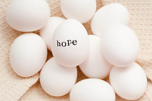 word hope on white eggs 
