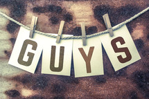The word, "guys, on a banner.