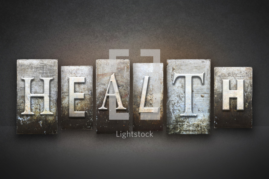 Stone tiles spelling the word HEALTH.