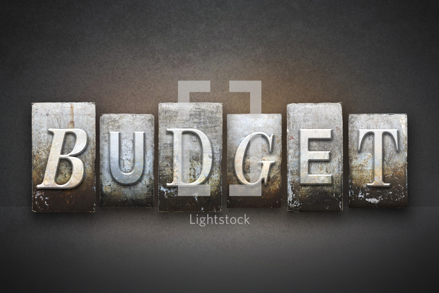 Stone tiles spelling the word BUDGET.