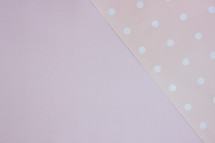 pink background with polka dots 