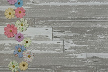 fabric flowers on a wood background 