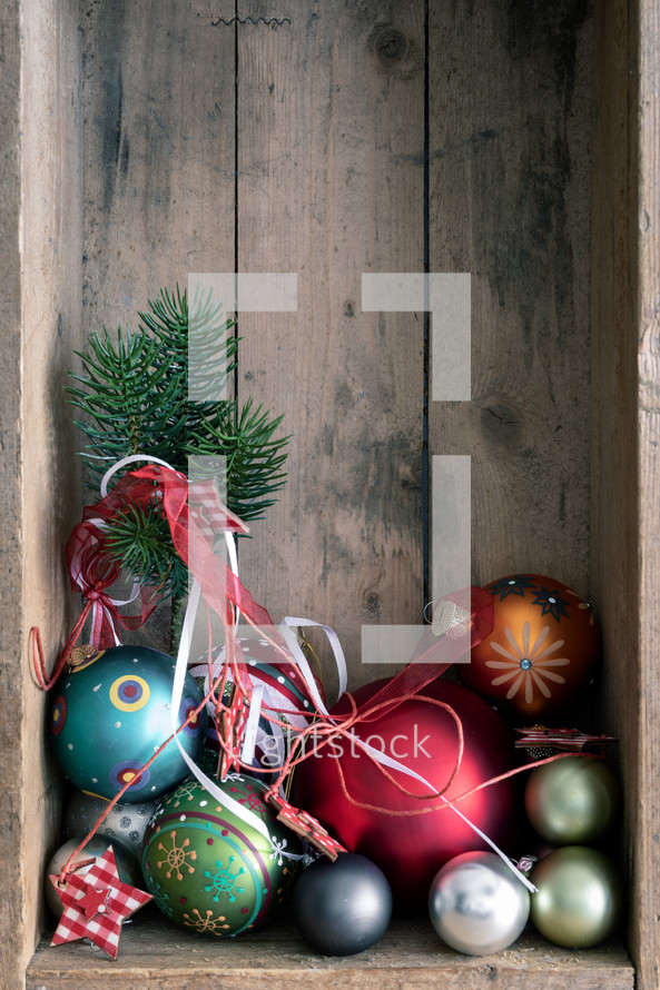 Christmas ornaments in a wooden crate 