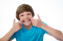 teen boy showing his teeth