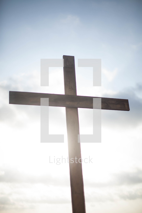 a wood cross in glowing sunlight 