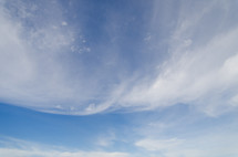 wispy clouds in a blue sky
