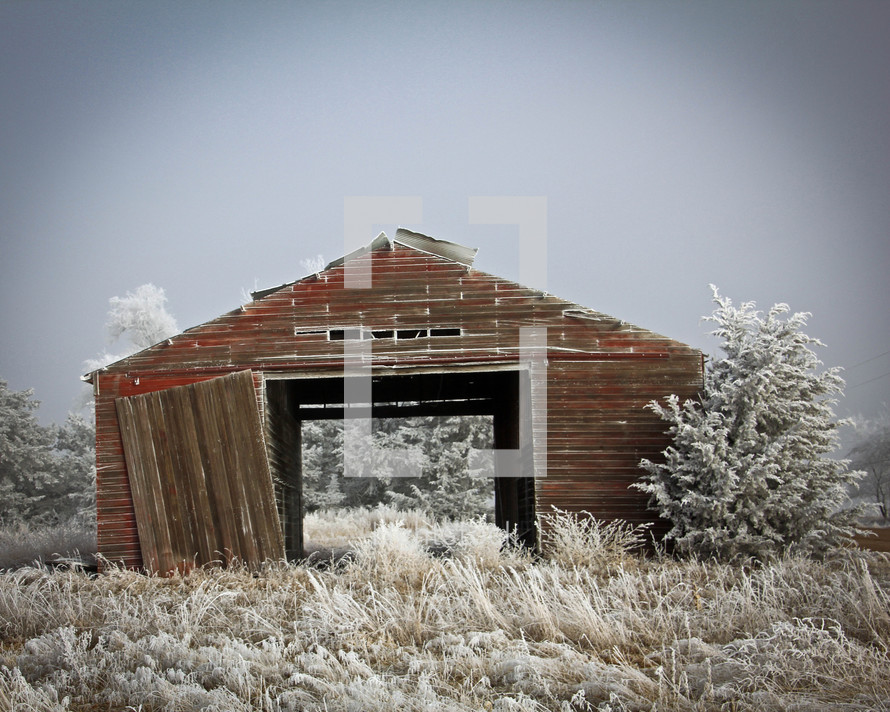 old barn in winter snow 
