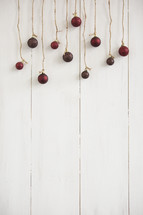 Christmas ornaments hanging from twine 