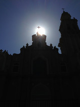 sunlight over a cross on a church