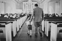 Father and son walking down the aisle