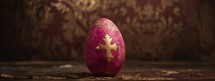 Painted easter egg on a wooden background